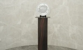 Image of the WELL Platinum 2025 award in display.